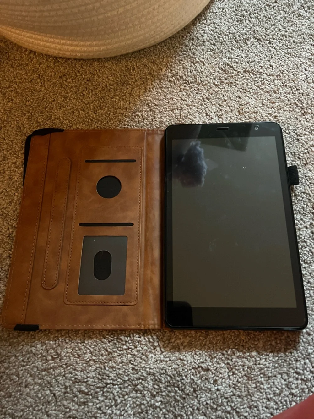 Tablet included with brown leather folio case